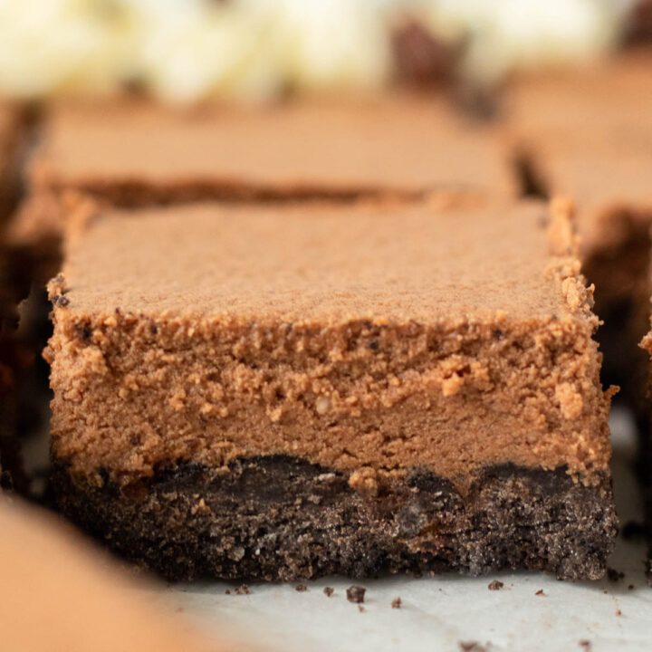 These Gluten-Free French Silk Pie Bars are a decadent chocolate pie recipe made with a gluten-free Oreo crust and rich chocolate mousse on top. These pie bars are the perfect dessert for a crowd and make a great holiday dessert.