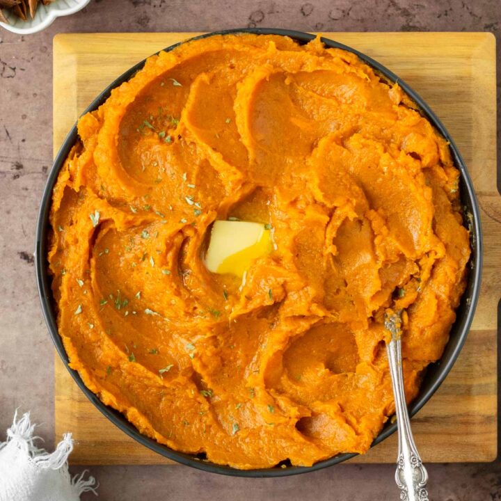 These mashed sweet potatoes are a creamy mashed potato side dish recipe made with sweet potatoes mashed with maple syrup and warm spices. This potato side dish recipe is perfect for a healthy weeknight dinner and a great holiday side dish recipe.