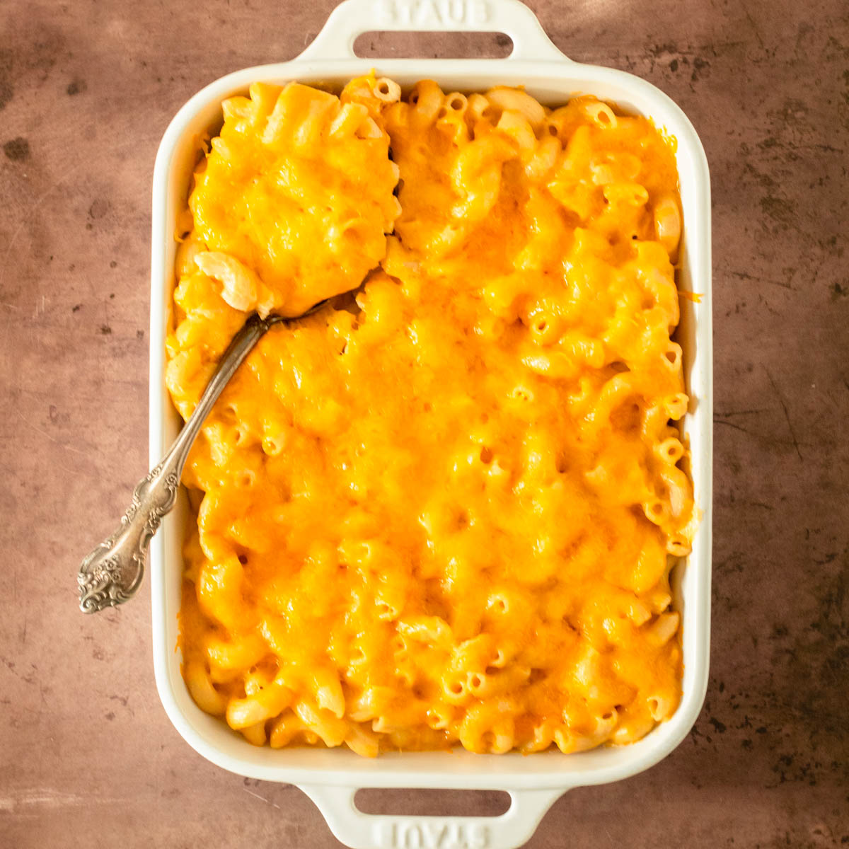 This gluten-free baked macaroni and cheese recipe is a rich and creamy three-cheese macaroni and cheese recipe perfect easy dinner and gluten-free side dish recipe.