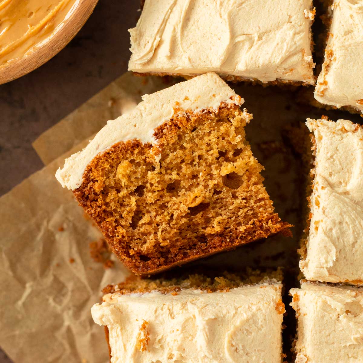 This peanut butter cake with peanut butter frosting is an easy snack cake recipe. This one-pan cake recipe is a soft and moist peanut butter cake topped with a creamy peanut butter frosting.