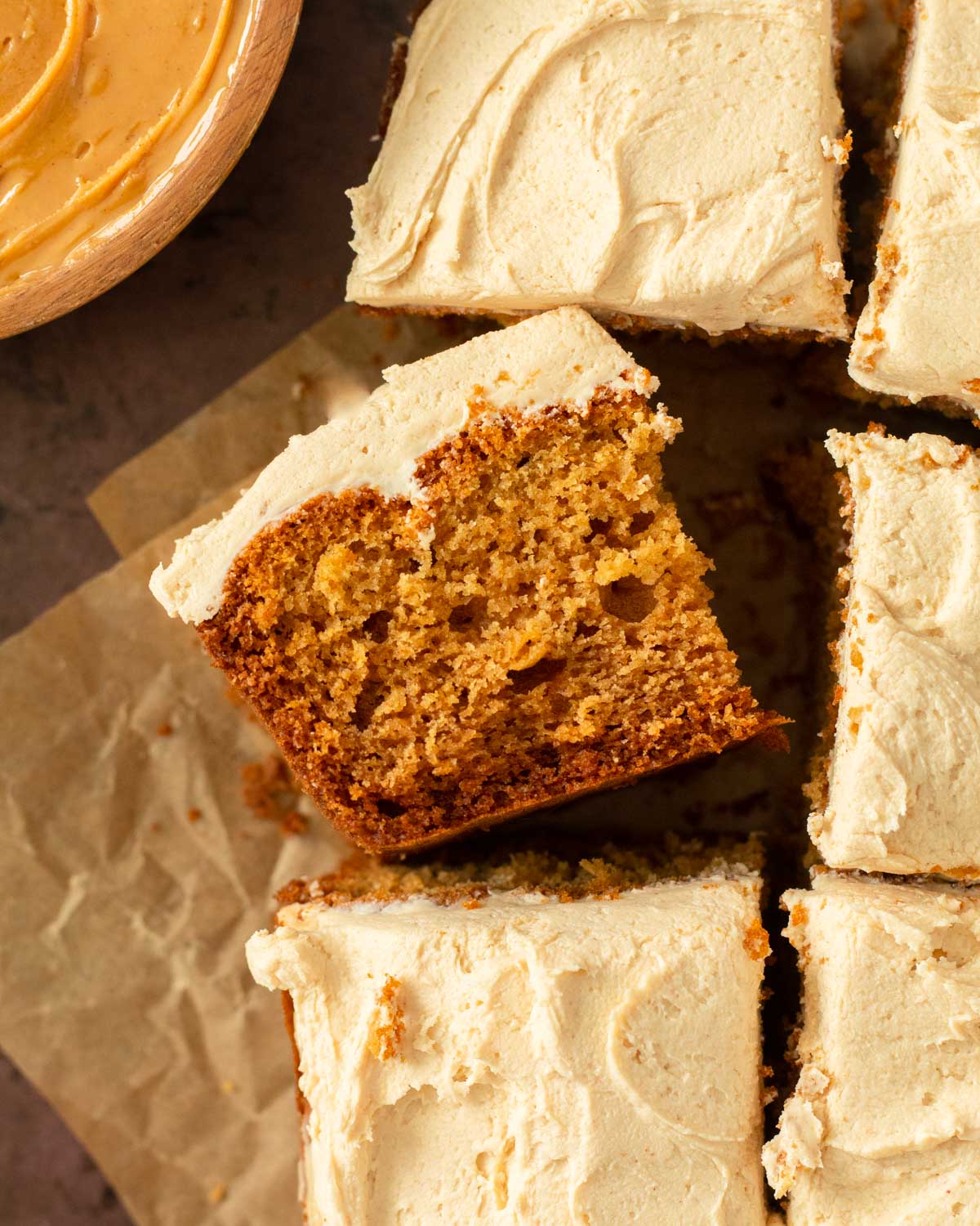 This peanut butter cake with peanut butter frosting is an easy snack cake recipe. This one-pan cake recipe is a soft and moist peanut butter cake topped with a creamy peanut butter frosting.