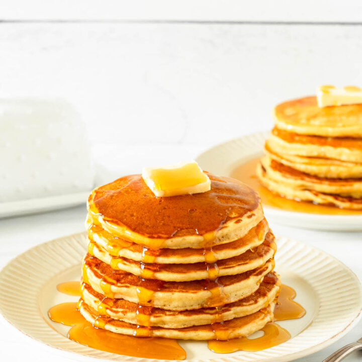 These gluten-free pancakes are a classic breakfast staple made with simple ingredients including gluten-free flour, milk, an egg, butter and honey for a delicious homemade breakfast.