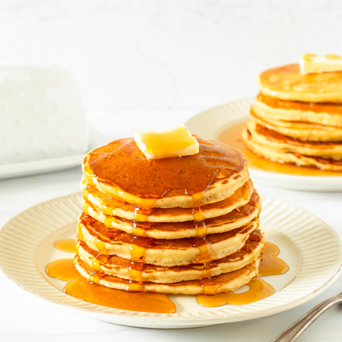 These gluten-free pancakes are a classic breakfast staple made with simple ingredients including gluten-free flour, milk, an egg, butter and honey for a delicious homemade breakfast.