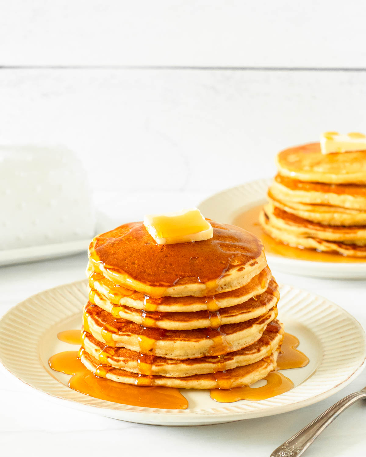 These gluten-free pancakes are a classic breakfast staple made with simple ingredients including gluten-free flour, milk, an egg, butter and honey for a delicious homemade breakfast.