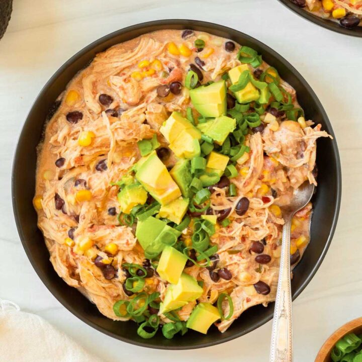 This crockpot cream cheese chicken chili is an easy dump and go crockpot recipe made with simple ingredients for a flavorful and filling comfort food meal.