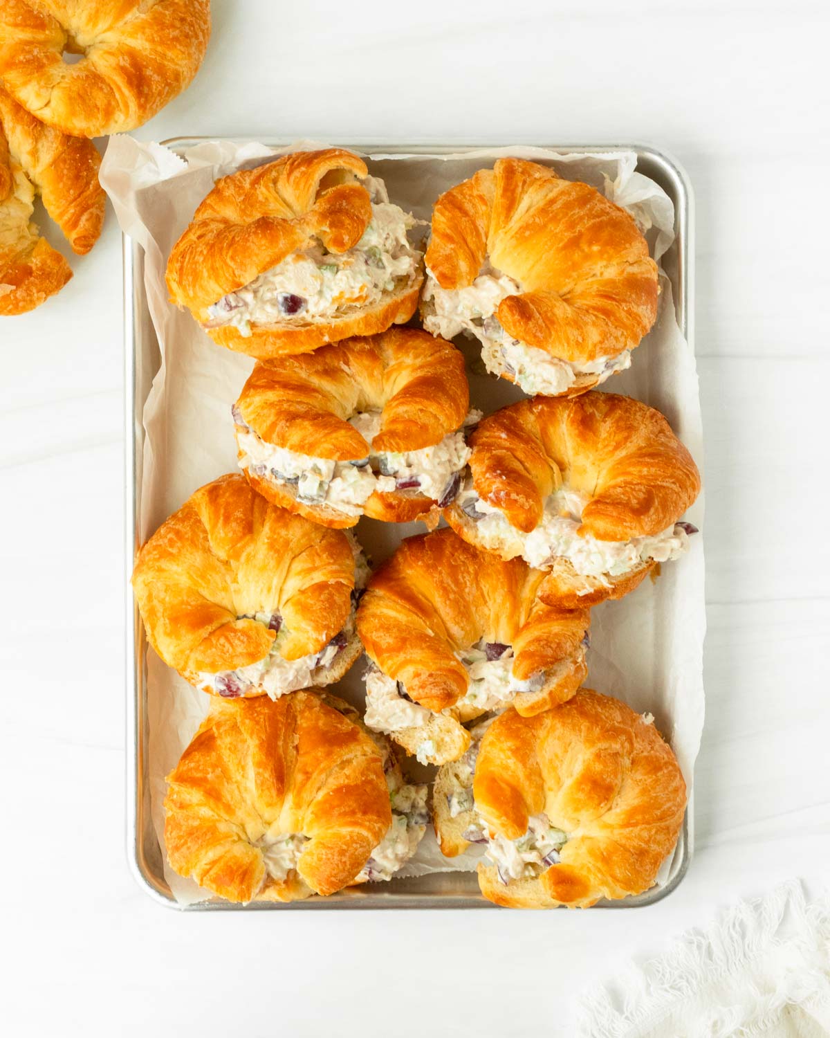 These chicken salad croissant sandwiches are a classic chicken salad made with simple ingredients and stuffed into a flaky, buttery croissant for a quick and flavorful meal.