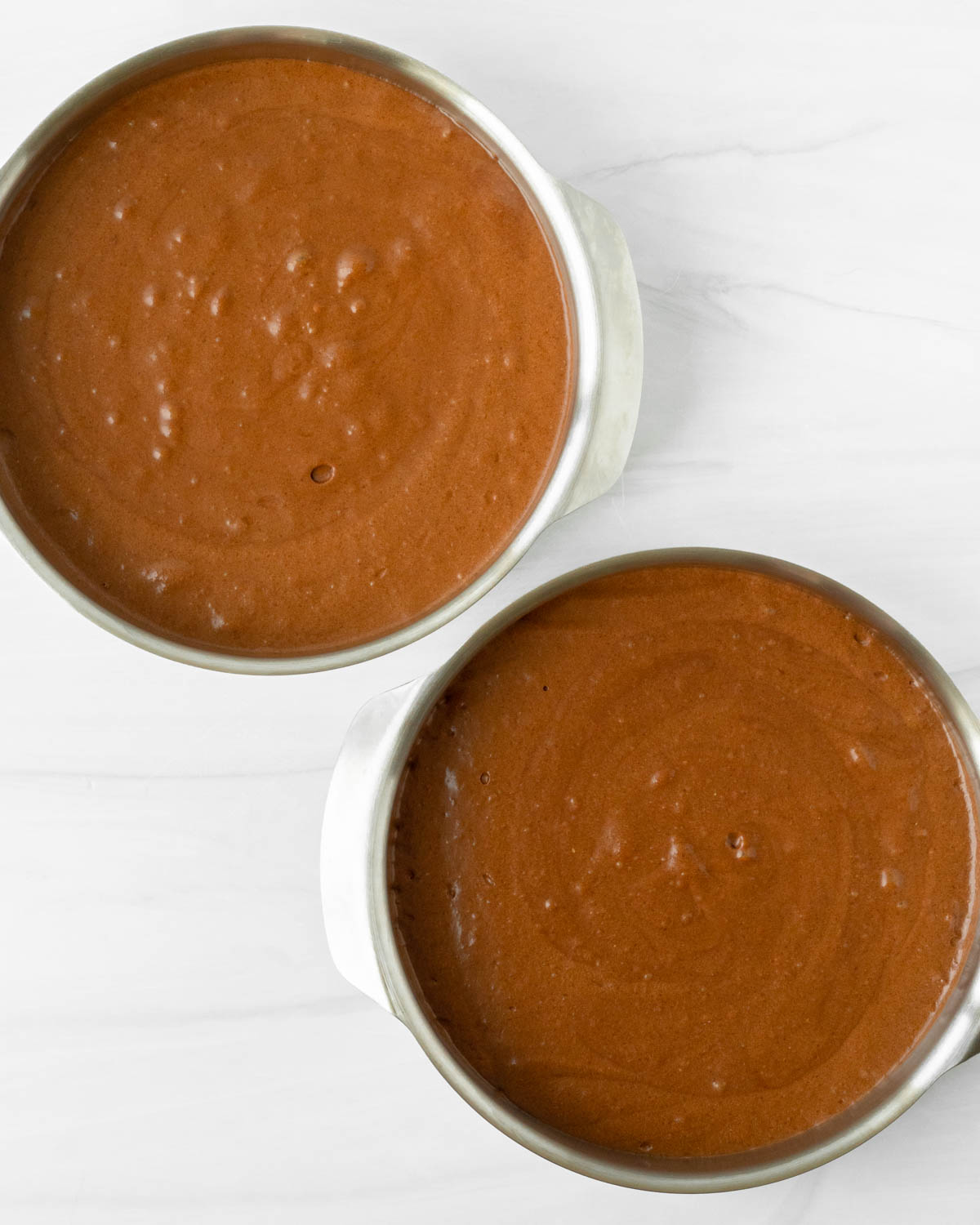 Step 2. Pour the batter into two round pans