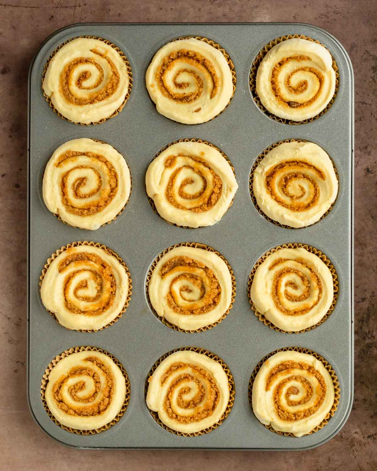 Step 2. Place each cinnamon roll in a muffin tin