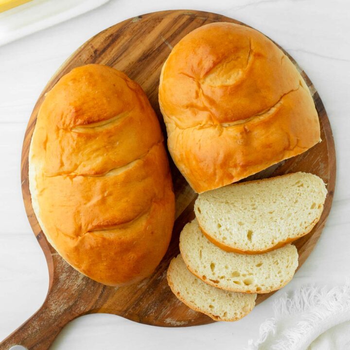 This homemade French bread recipe is an easy yeast bread recipe made with simple ingredients for a flavorful, soft bread perfect for using in French toast, sandwiches like grilled cheese, and making into French bread pizza.