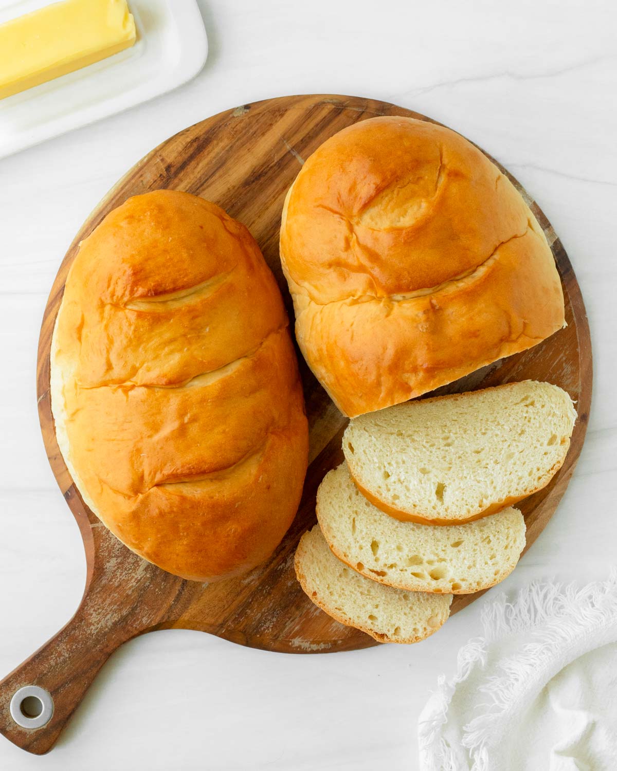 This homemade French bread recipe is an easy yeast bread recipe made with simple ingredients for a flavorful, soft bread perfect for using in French toast, sandwiches like grilled cheese, and making into French bread pizza.