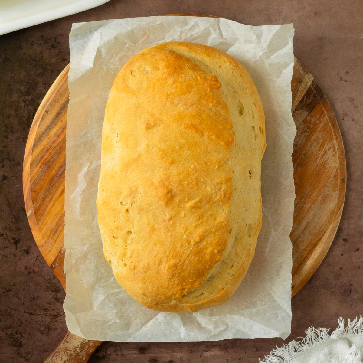 This homemade Italian bread recipe is an easy yeast bread recipe made with simple ingredients for a flavorful, soft bread perfect for serving with pasta or homemade lasagna and great for making into garlic bread.