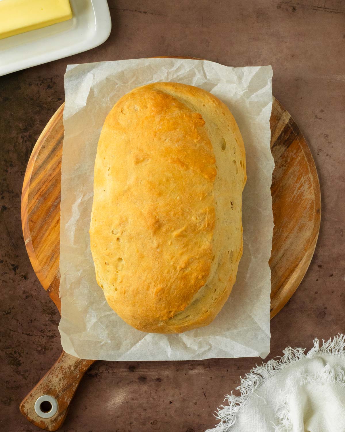 This homemade Italian bread recipe is an easy yeast bread recipe made with simple ingredients for a flavorful, soft bread perfect for serving with pasta or homemade lasagna and great for making into garlic bread.