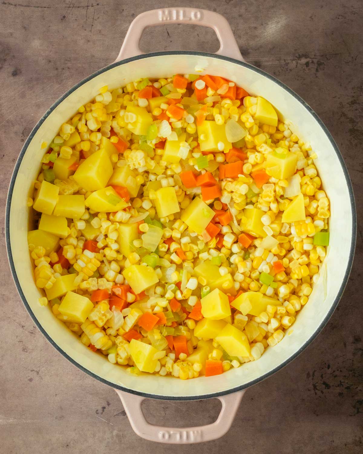 Step 2. Add corn and potatoes and stir to combine