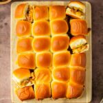 These Bacon Cheeseburger Sliders are an easy and delicious Hawaiian roll pull-apart sandwich recipe made with ground beef, bacon and cheese layered inside perfectly baked Hawaiian rolls for an easy dinner, delicious appetizer and the perfect recipe to serve a crowd.