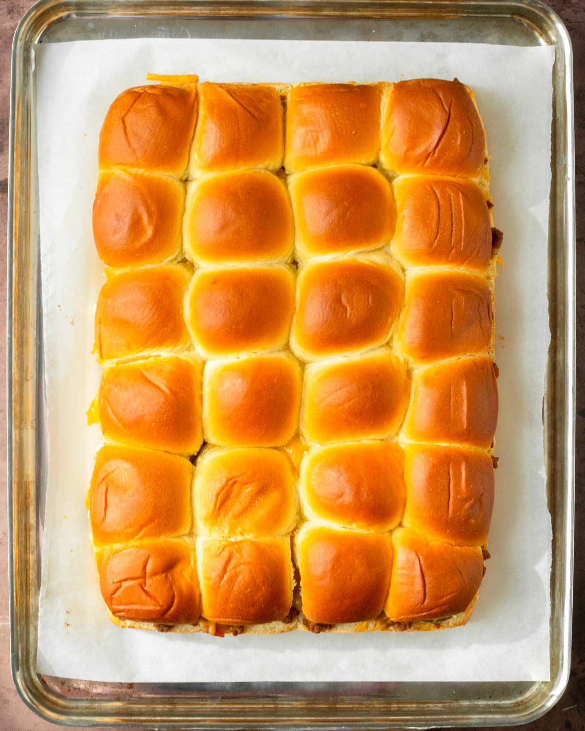 Step 4. Place the top rolls on top, brush the rolls with butter and bake in the oven