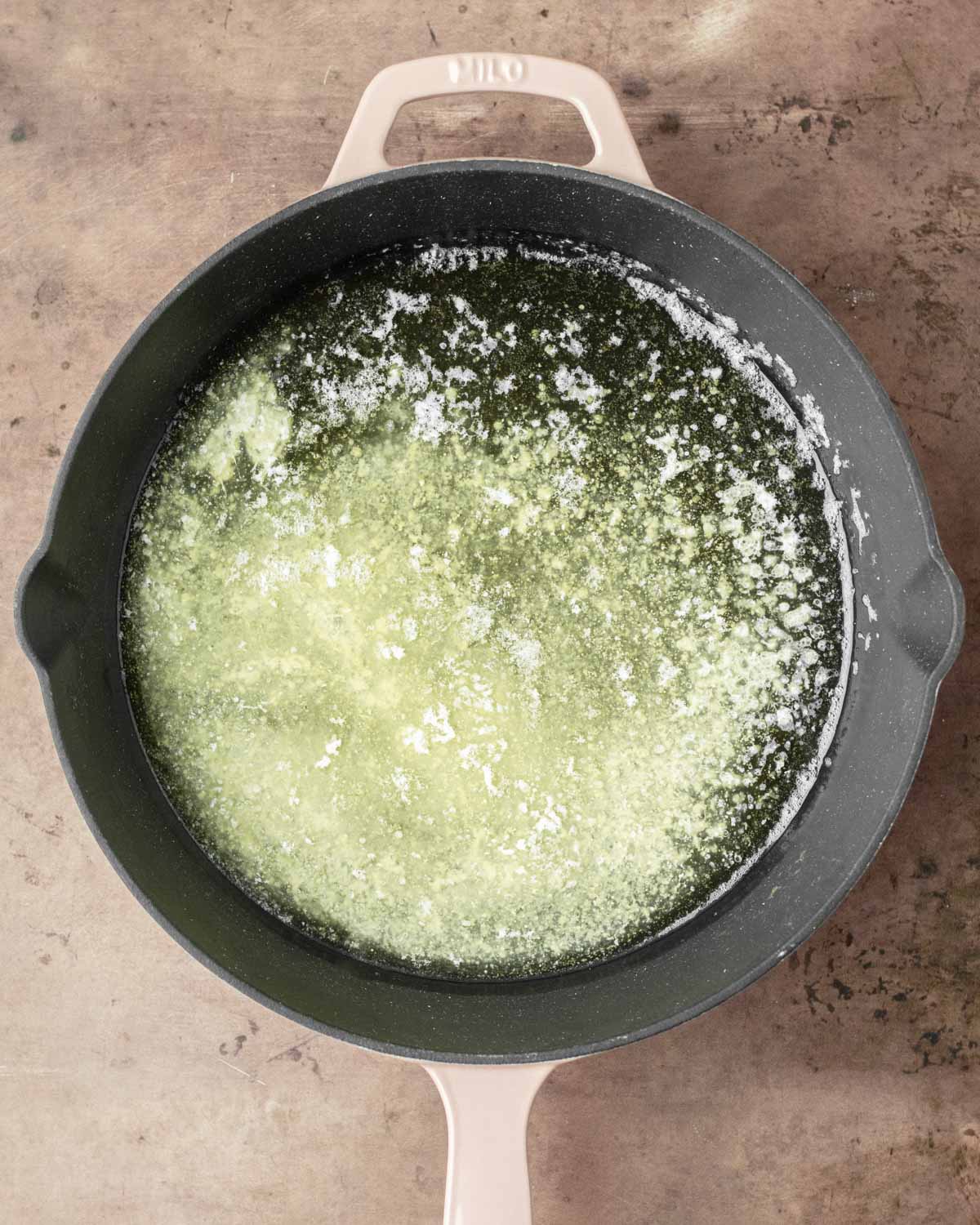 Step 3. Melt the butter in the skillet in the oven