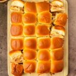 These BBQ pulled pork sliders are an easy and delicious Hawaiian roll pull-apart sandwich recipe made with BBQ pulled pork and Pepper Jack cheese layered inside perfectly baked Hawaiian rolls for an easy dinner, delicious appetizer and the perfect recipe to serve a crowd.