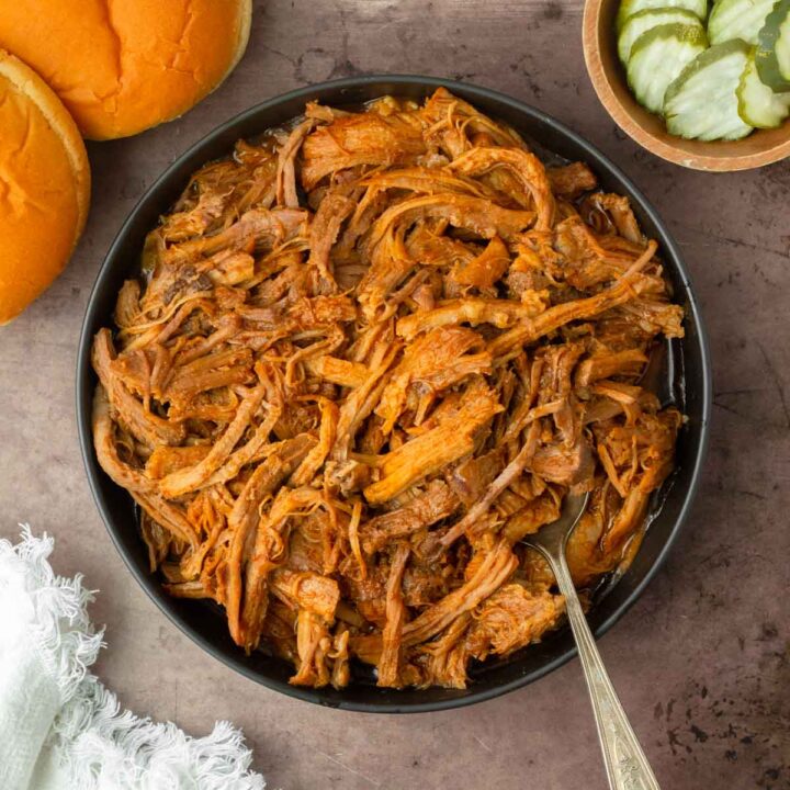 This crockpot BBQ pulled pork recipe is a great slower cooker pork recipe perfect for easy weeknight dinners and delicious summer cookouts.