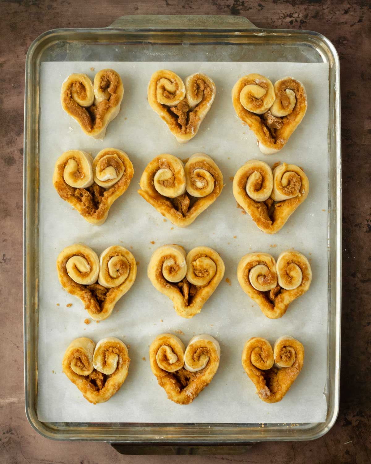 Step 2. Roll the dough out, top with filling, cut into strips & shape into hearts