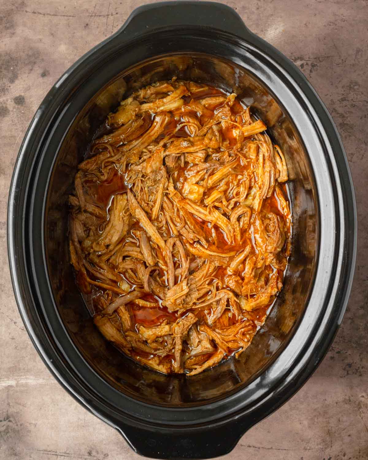 Step 4. Shred the pork and stir to combine the pork with the sauce before serving